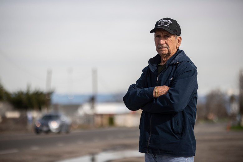 Madera resident 80-year-old Pedro Dominguez standing near a busy street in town on Jan. 12, 2023. Dominguez said the recent closure of the hospital has him concerned for his wife, Elpidia Sanchez de Jesús, who suffers from asthma.