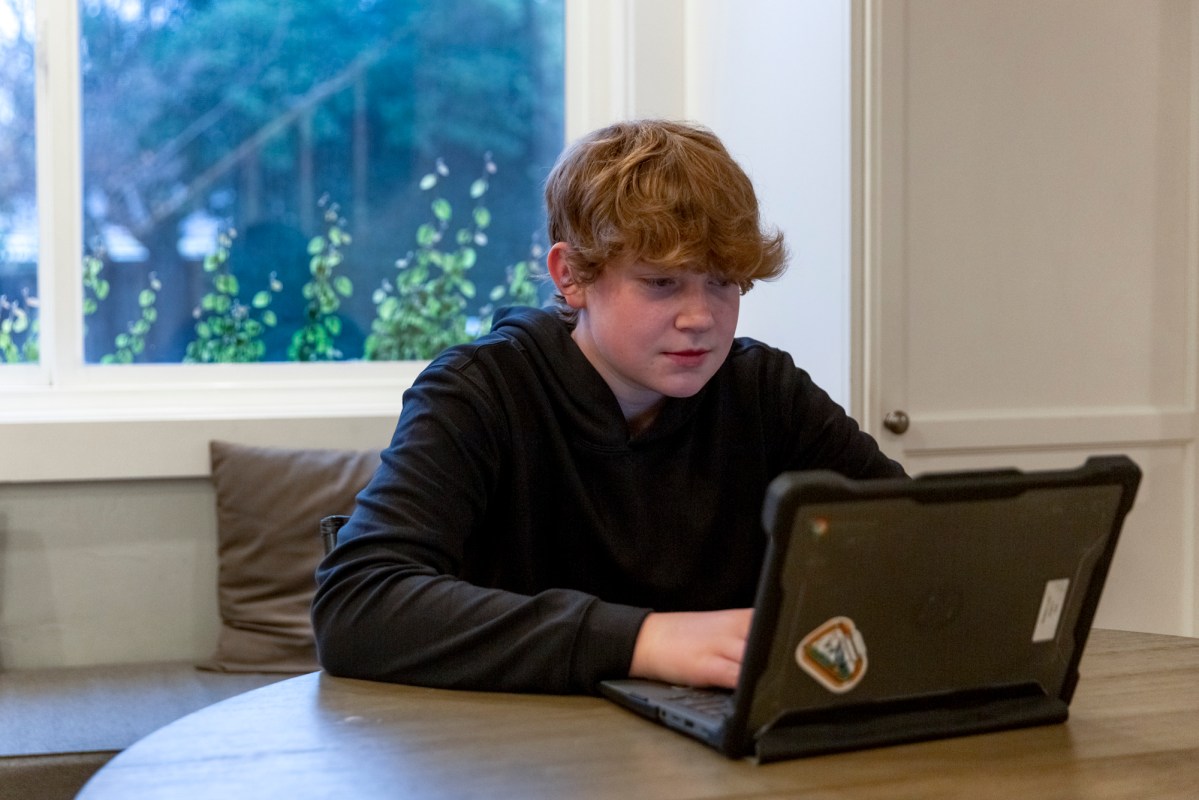 Dominic Levy does homework at his home in Clayton on Jan. 29, 2023. Photo by Shelby Knowles for CalMatters