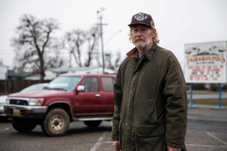 Jeff England manages the Trinity County Food Bank distribution at the Trinity County Fairgrounds on Feb. 8, 2023. Photo by Martin do Nascimento, CalMatters