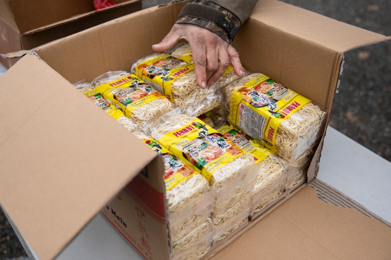 Chow mein-style noodles are part of the "cultural bags" distributed to Hmong community members by the Trinity County Food Bank at the Trinity County Fairgrounds on Feb. 8, 2023. Photo by Martin do Nascimento, CalMatters