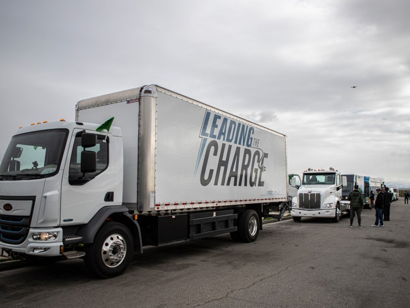 A fleet of electric vehicles lined up for the Zero Emissions Convoy in Bakersfield on Feb. 23, 2023. Photo by Larry Valenzuela, CalMatters/CatchLight Local