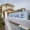 A "for sale" sign is posted in front of a home in Sacramento on March 3, 2022. Photo by Rich Pedroncelli, AP Photo