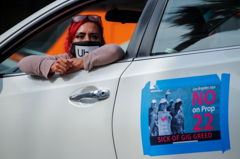 App-based gig worker Terresa Mercado participates in a demonstration outside Los Angeles City Hall to urge voters to vote no on Proposition 22 in Los Angeles on Oct. 8, 2020. Photo by Mike Blake, Reuters