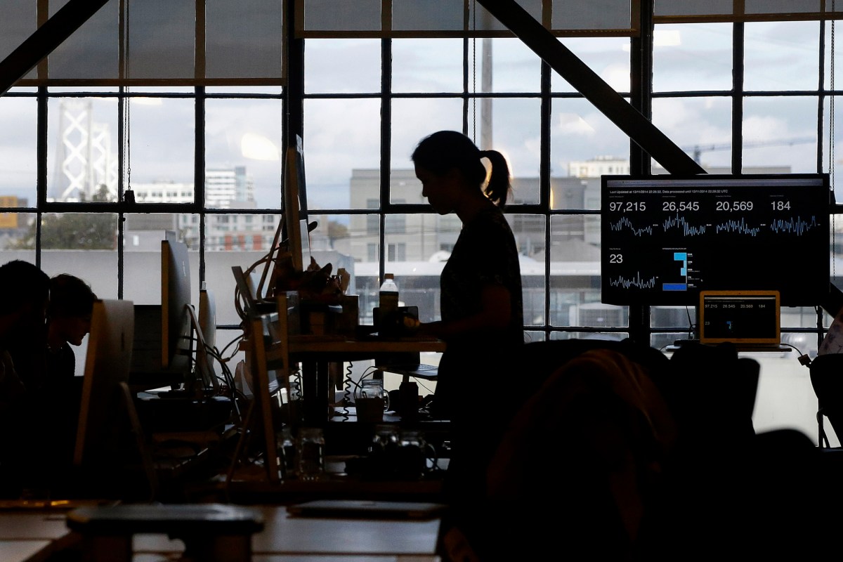 Employees at Pinterest work at their desks in San Francisco on Nov. 13, 2014. Photo by Jeff Chiu, AP Photo