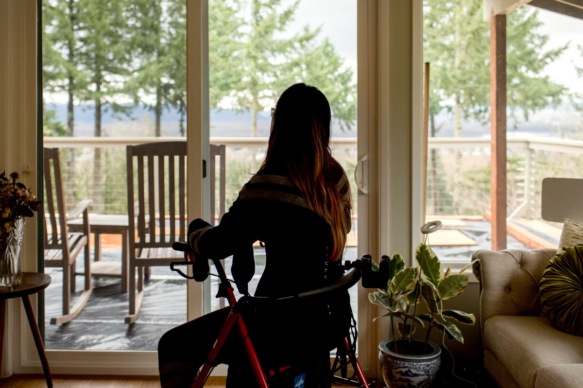 Mindy Lym has been living with long COVID since the summer of 2022. After months of bed rest, she's now living in Camas, Washington, where her symptoms are improving but are still a day to day challenge. Photo by Celeste Noche for CalMatters