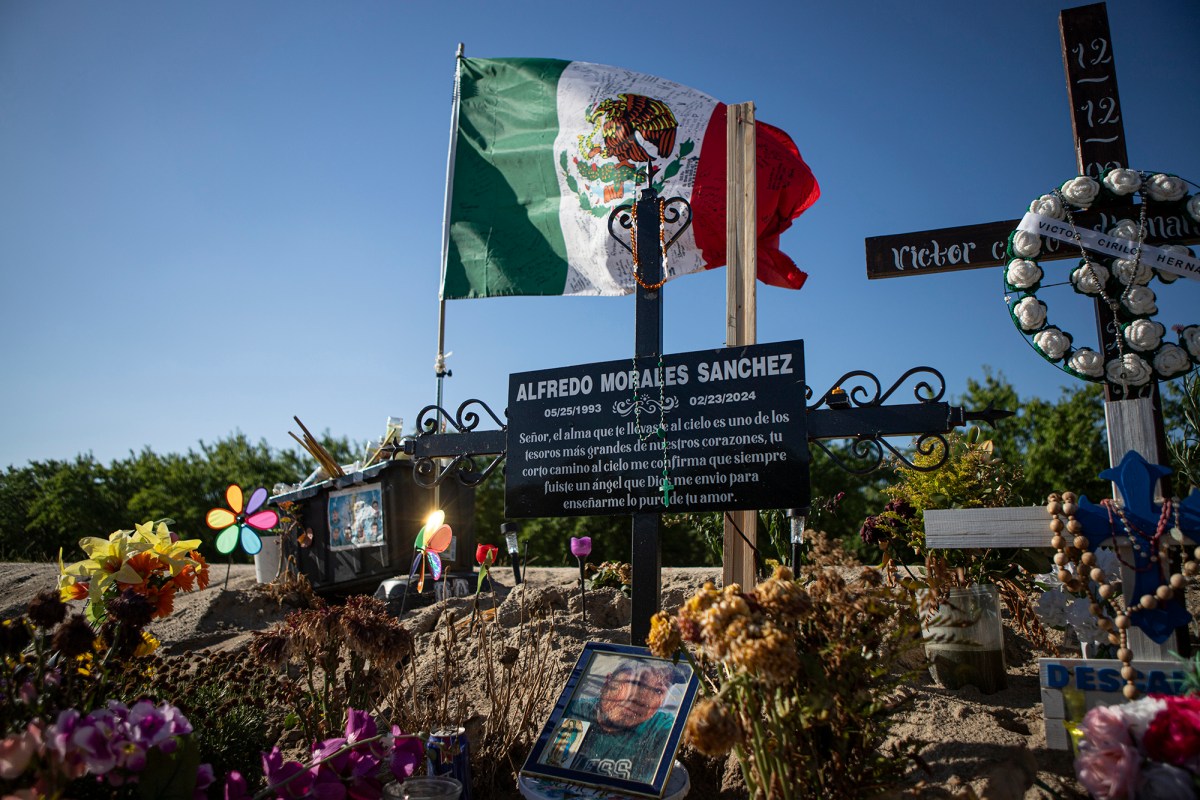 A memorial for seven farm workers killed while driving to work in Madera County. California lawmakers acted to regulate the vans that take farmworkers to the fields. However, few vehicles are covered under the regulations now, leaving it less clear who is responsible for workers’ safety. Photo by Larry Valenzuela, CalMatters/CatchLight Local