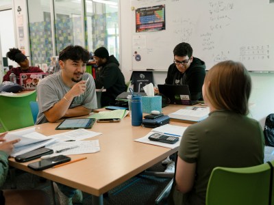 Students discuss their work in class at the MESA center at American River College on April 25, 2024. Photo by Cristian Gonzalez for CalMatters