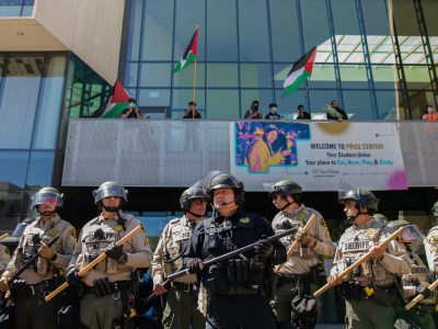 San Diego Sheriff's deputies and University of California campus officers stand guard at a pro-Palestinian protest at UC San Diego in San Diego on May 6, 2024. Photo by Adriana Heldiz, CalMatters