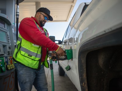 Adrian De La Cruz fills his work truck with diesel gas at a filling station in west Fresno on May 7, 2024. Photo by Larry Valenzuela, CalMatters/CatchLight Local