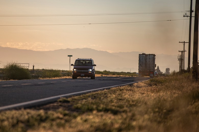 A van driving westbound down Avenue 7 towards Firebaugh in Madera County on May 13, 2024. Photo by Larry Valenzuela, CalMatters/CatchLight Local