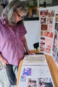 Susan Ottele looks at a sketch portrait of her son Adam Joseph Collier who committed suicide while in solitary confinement in a California state prison. Photo by Tojo Andrianarivo for CalMatters