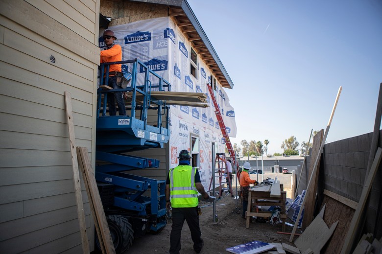 Construction workers building an apartment complex site for an affordable housing project in Bakersfield on May 29, 2024. Photo by Larry Valenzuela, CalMatters/CatchLight Local