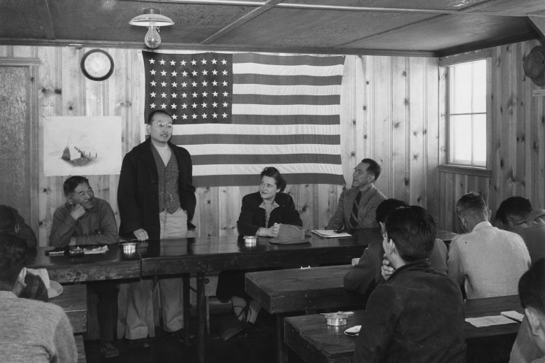 A town hall meeting at the Manzanar Relocation Center in California. Over 12,000 Japanese Americans were incarcerated at Manzanar during World War II from March 1942 until November 1945. Photo by Ansel Adams, Library of Congress