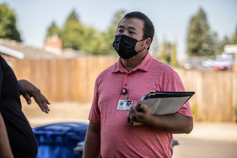 STD Investigator Hou Vang speaks with a pregnant patient to inform them of their diagnosis and provide information on July 14, 2022. Photo by Larry Valenzuela, CalMatters/CatchLight Local