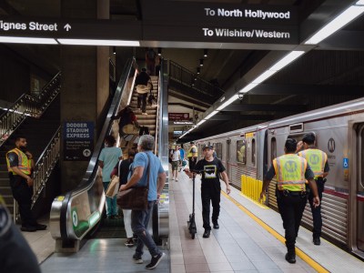 People walk through an underground subway station in Los Angeles.