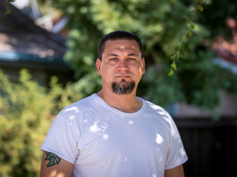 Quentin Nelms in front of his home in Tulare on July 26, 2022. Photo by Larry Valenzuela, CalMatters/CatchLight Local