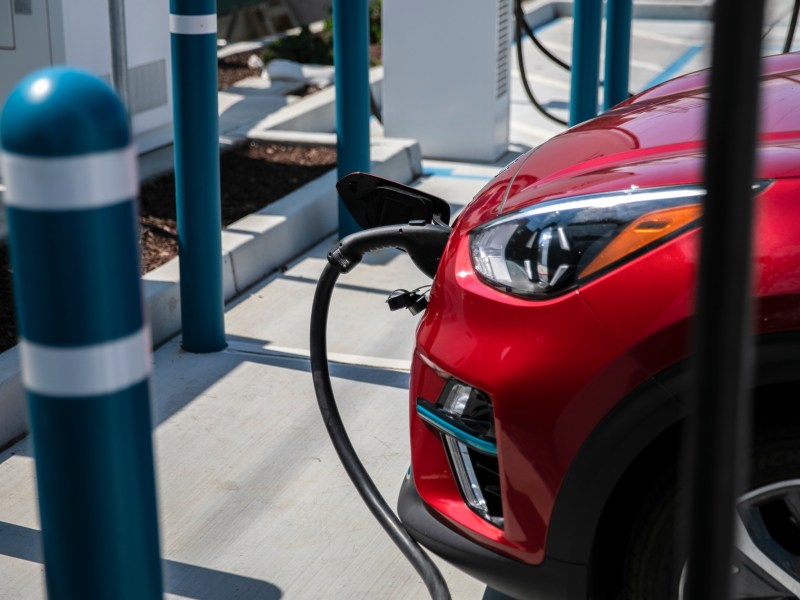 An electric vehicle charging station in Millbrae. Photo by Martin do Nascimento, CalMatters