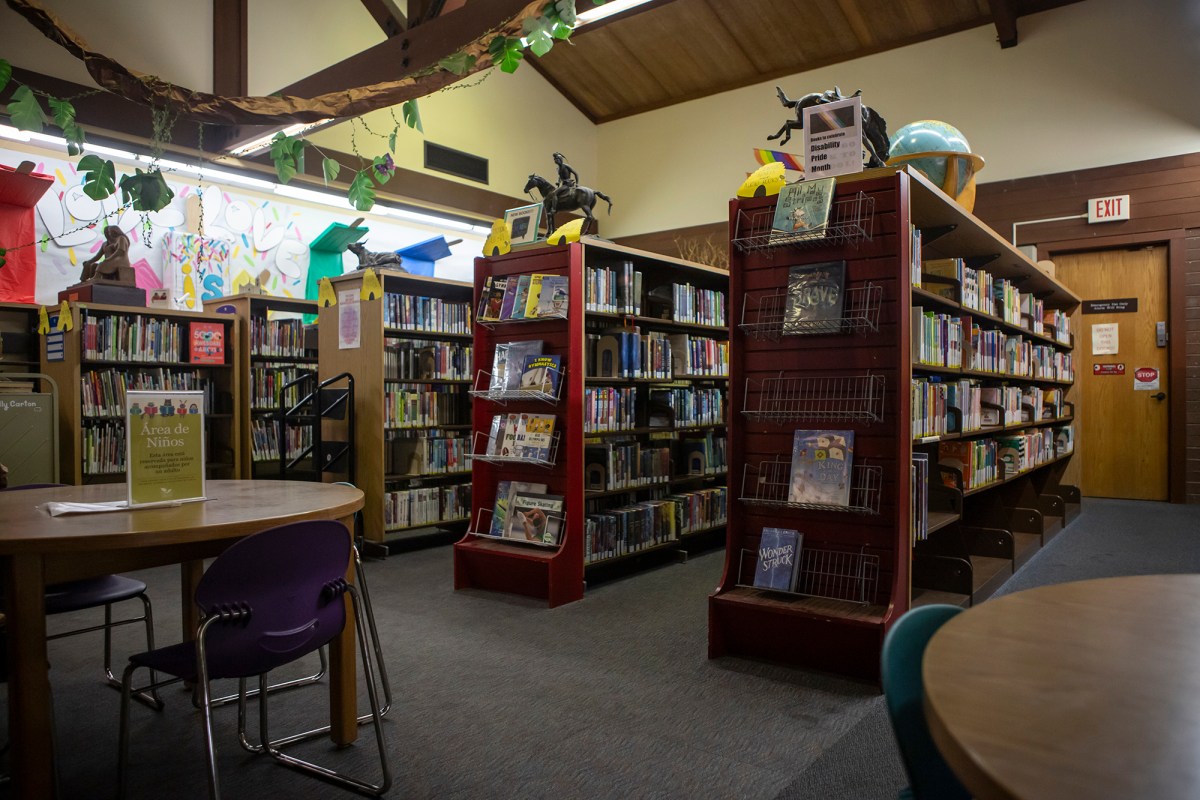 Book shelves lined up in the Fresno County Library Clovis Branch on July 31, 2024. Photo by Larry Valenzuela, CalMatters/CatchLight Local