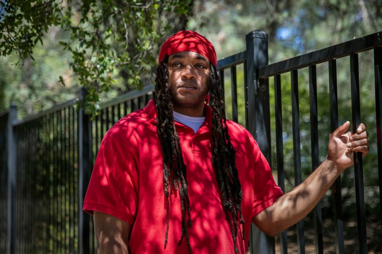 Lorenzo Mays poses for a photo outside the halfway house where he lives in Shingle Springs on Aug, 10, 2022. Photo by Martin do Nascimento, CalMatters