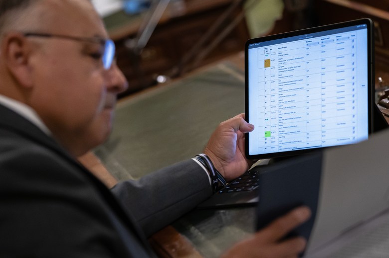 Assemblymember Freddie Rodriguez, a Ponoma Democrat, tracks bills during session at the state Capitol in Sacramento on Aug. 24, 2023.