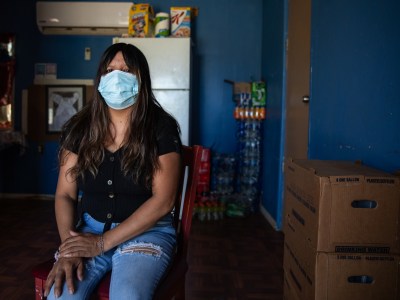 Entrika Zacarias sits in her home at Oasis Mobile Home Park in Coachella Valley on Aug. 23, 2023.