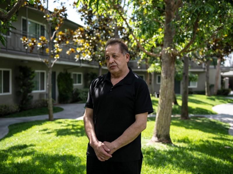 Manuel Chavez, who is involved in a protracted wage theft case that has been appealed multiple times, stands for a portrait in Downey on Sept. 4, 2022. “I worked hard hours, and sometimes all night long,” Chavez said, in regards to working as a hotel employee. “The pay always seemed to come up short for the amount of work I did.” Photo by Pablo Unzueta for CalMatters