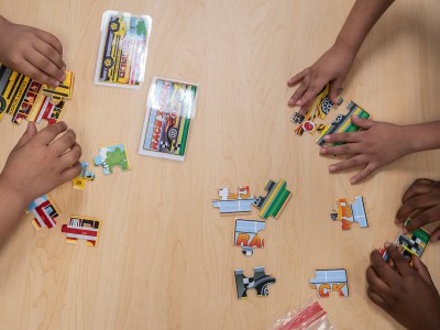 Students work on puzzles in the transitional kindergarten program at Westwood Elementary School in Stockton on Sept. 22, 2023. Photo by Loren Elliott for CalMatters