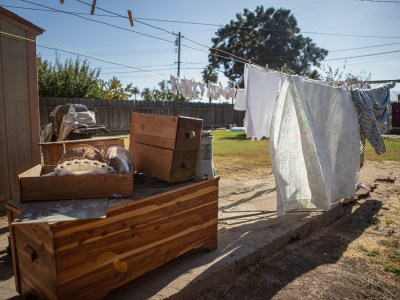 Home items in Carolyn Young's yard on Oct. 26, 2023. Planada residents had to throw out many of their possessions after their homes flooded earlier in the year during torrential rain storms. Oct. 26 2023. Photo by Larry Valenzuela, CalMatters/CatchLight Local