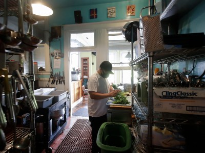 A prep cook works in the kitchen of a San Francisco restaurant on May 14, 2020. Photo by Jeff Chiu, AP Photo