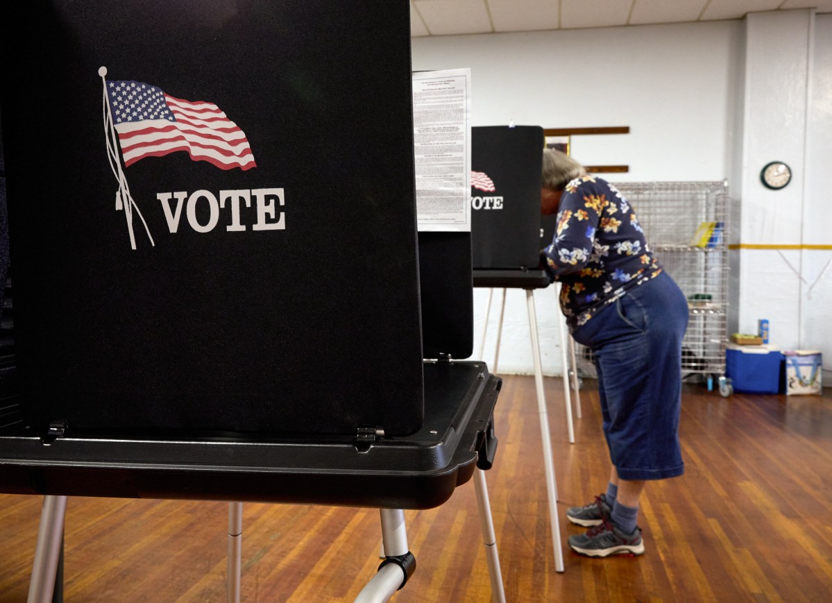 A voter fills out their ballot at a polling station at the American Legion in Shasta Lake, California, during a special election in Shasta County November 7, 2023.