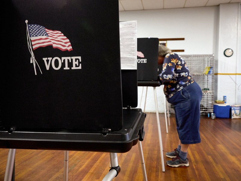 A voter fills out their ballot at a polling station at the American Legion in Shasta Lake, California, during a special election in Shasta County November 7, 2023.