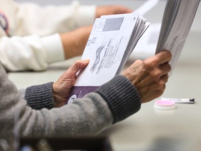 Poll workers process ballots at the Shasta County Elections office in Redding, California on November 7, 2023.