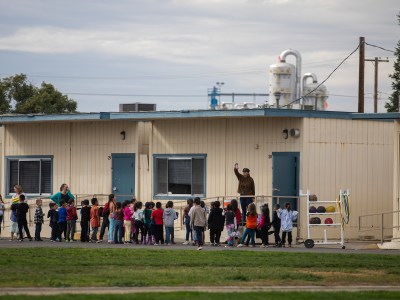 Students line up to enter their classrooms at Keyes Elementary School in Keyes on Nov. 15, 2023. Photo by Larry Valenzuela, CalMatters/CatchLight Local