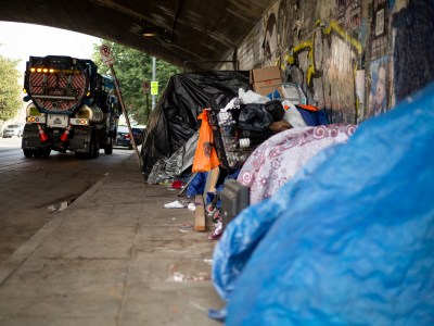 A row of tents under an overpass in east Los Angeles on Nov. 17, 2021.