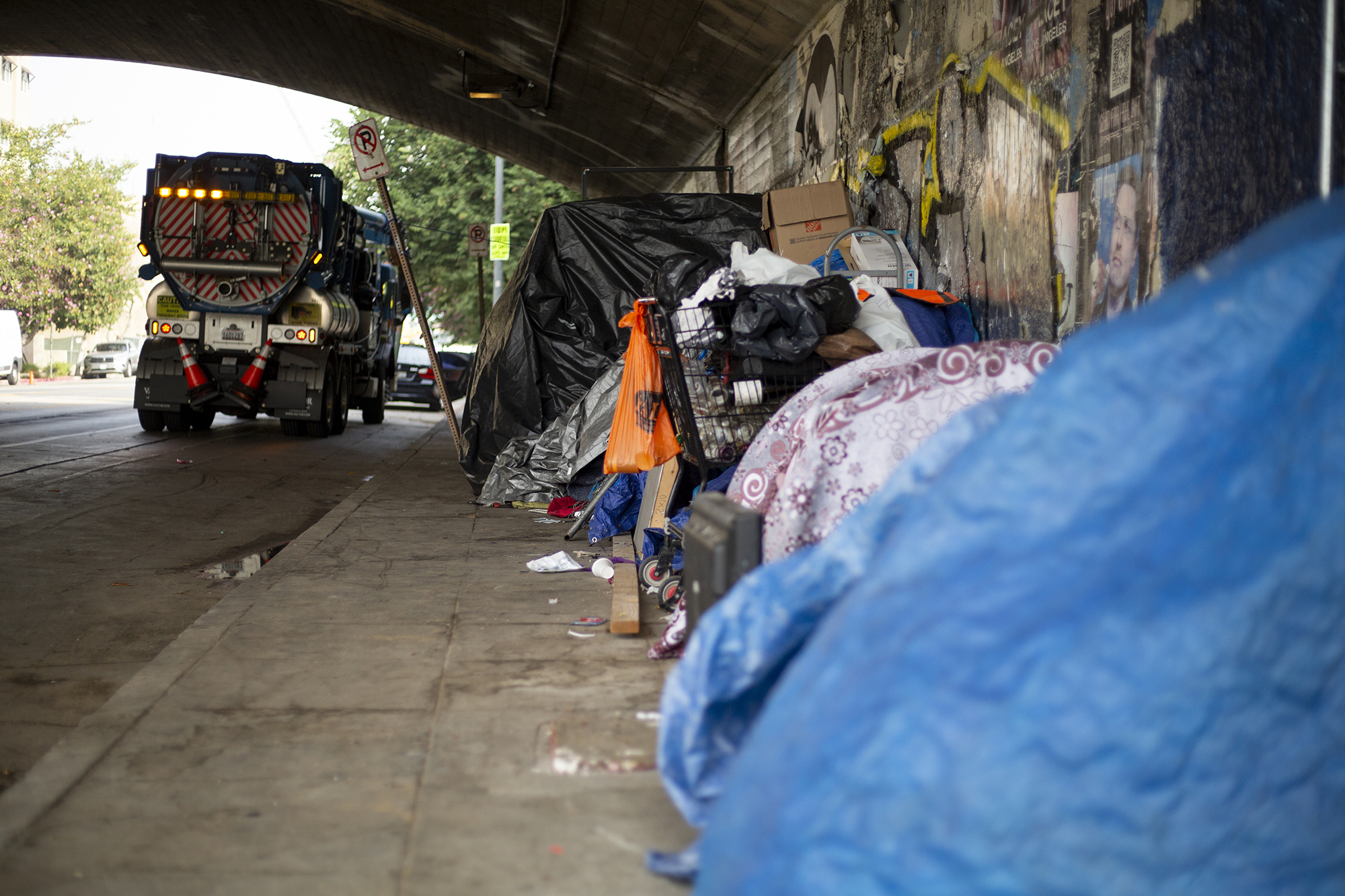 A row of tents under an overpass in east Los Angeles on Nov. 17, 2021.