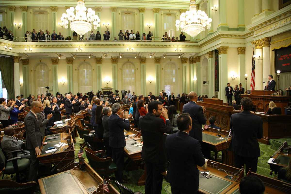 California legislators applaud Gov. Gavin Newsom as he delivers his first State of the State speech. Photo by Andrew Nixon, Capital Public Radio