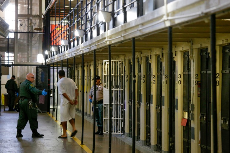 A condemned inmate is led out of his east block cell on death row at San Quentin State Prison, in San Quentin Aug. 16, 2016. Photo by Eric Risberg, AP Photo