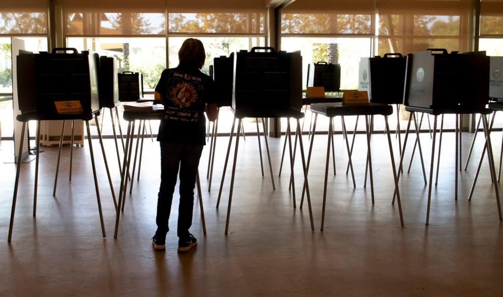 Poll workers prepare the voting center at Lake Forest Sports Park for Friday’s opening on Wednesday, October 28, 2020. Photo by Mindy Schauer, Orange County Register/SCNG