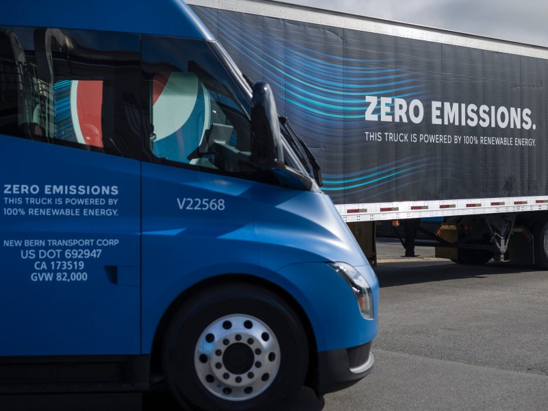 A fleet of Tesla Semis on display at PepsiCo Beverages North America's Sacramento facility on April 11, 2023. PBNA hosted an event to celebrate the arrival of 18 Tesla Semi-trucks to its Sacramento location. Photo by Miguel Gutierrez Jr., CalMatters